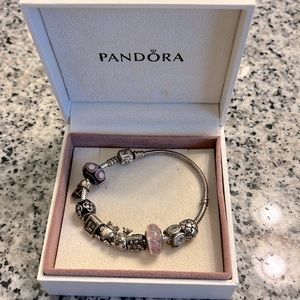 Pandora bracelet with 10 charms. 7 inch bracelet.
